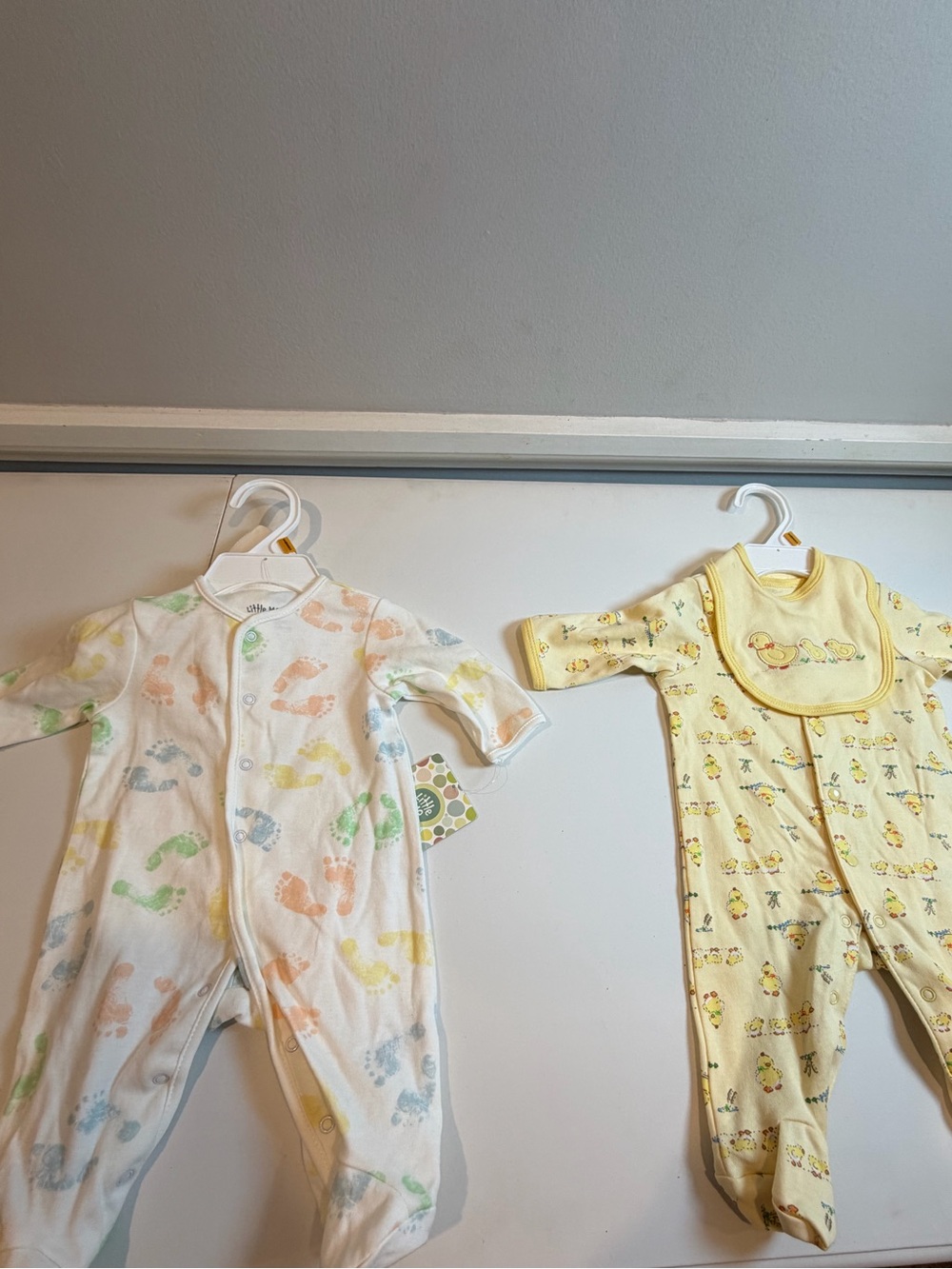 Bundle of 2 Little Me footies-both size newborn